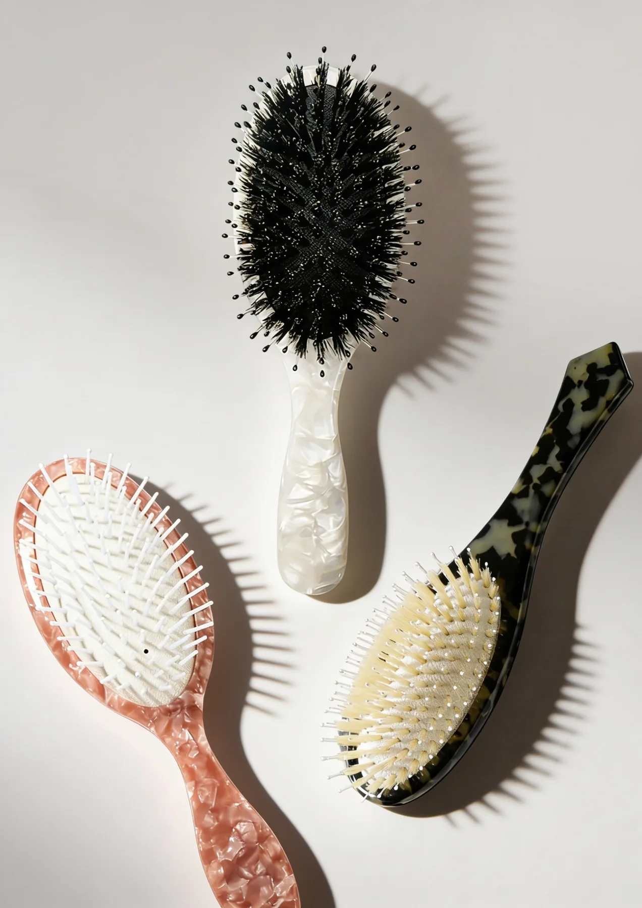 Pearl and tortoiseshell acetate cushion hairbrush designs from the Junyi catalogue