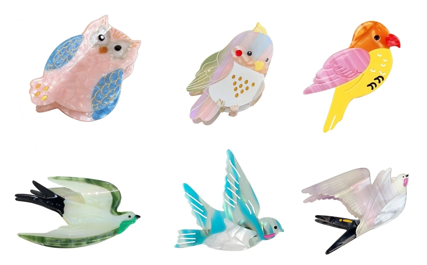Multi-piece acetate bird decorations shown on assembled clip bases