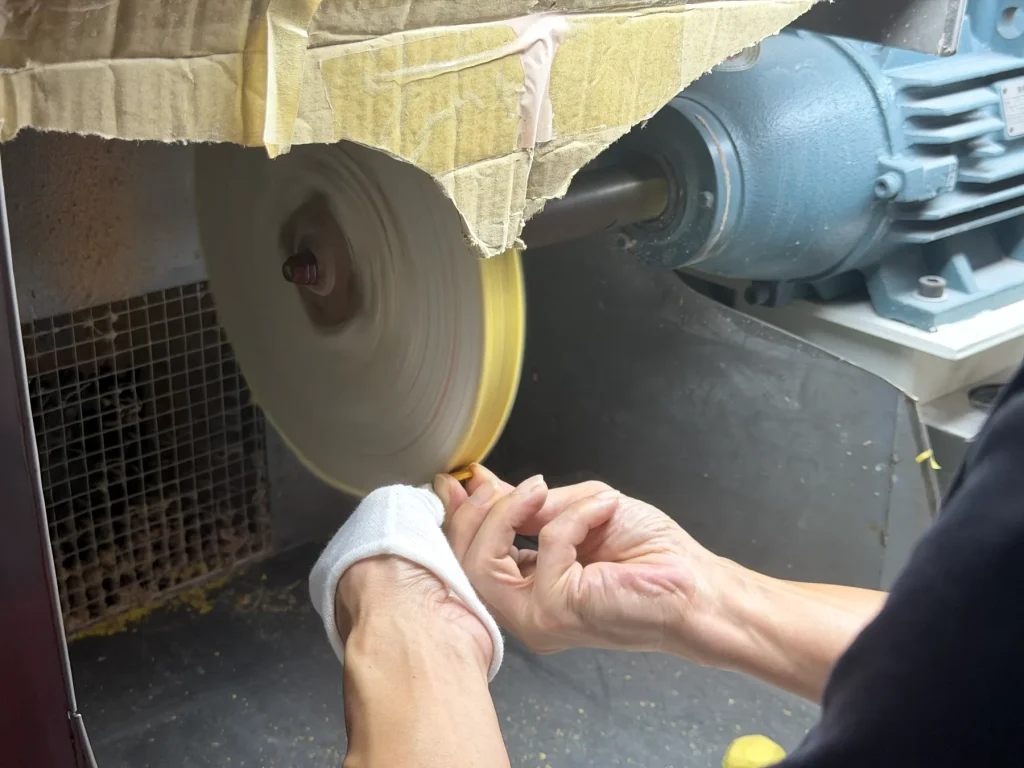Buffing wheel polishing acetate edge