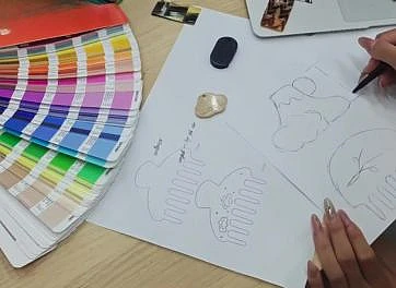 Color references and product sketches for discussing custom acetate project requirements