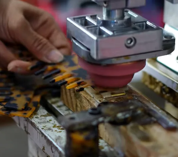 Pad printing a logo on an acetate hair clip