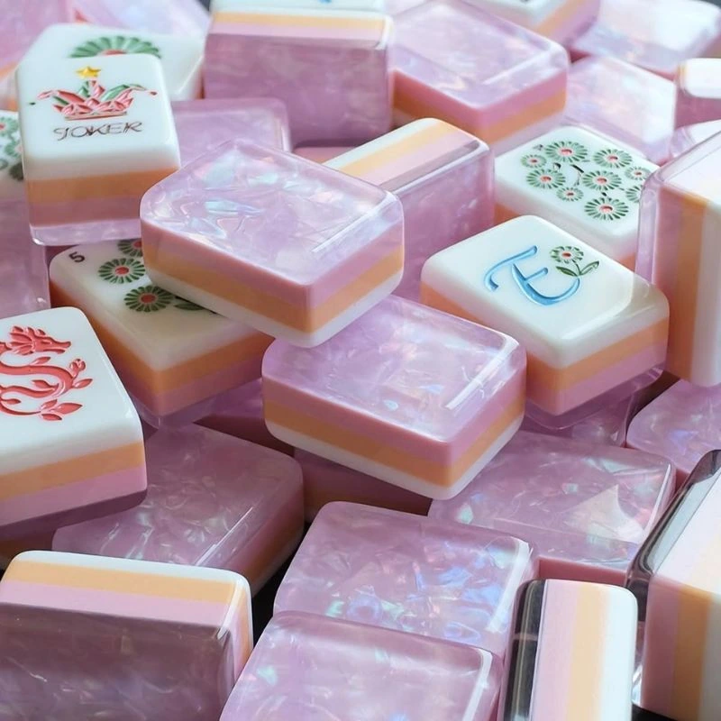 Pink pearlescent-pattern mahjong tiles with layered edges and printed faces